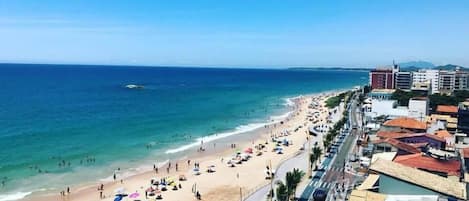 On the beach, sun loungers, beach umbrellas, beach towels