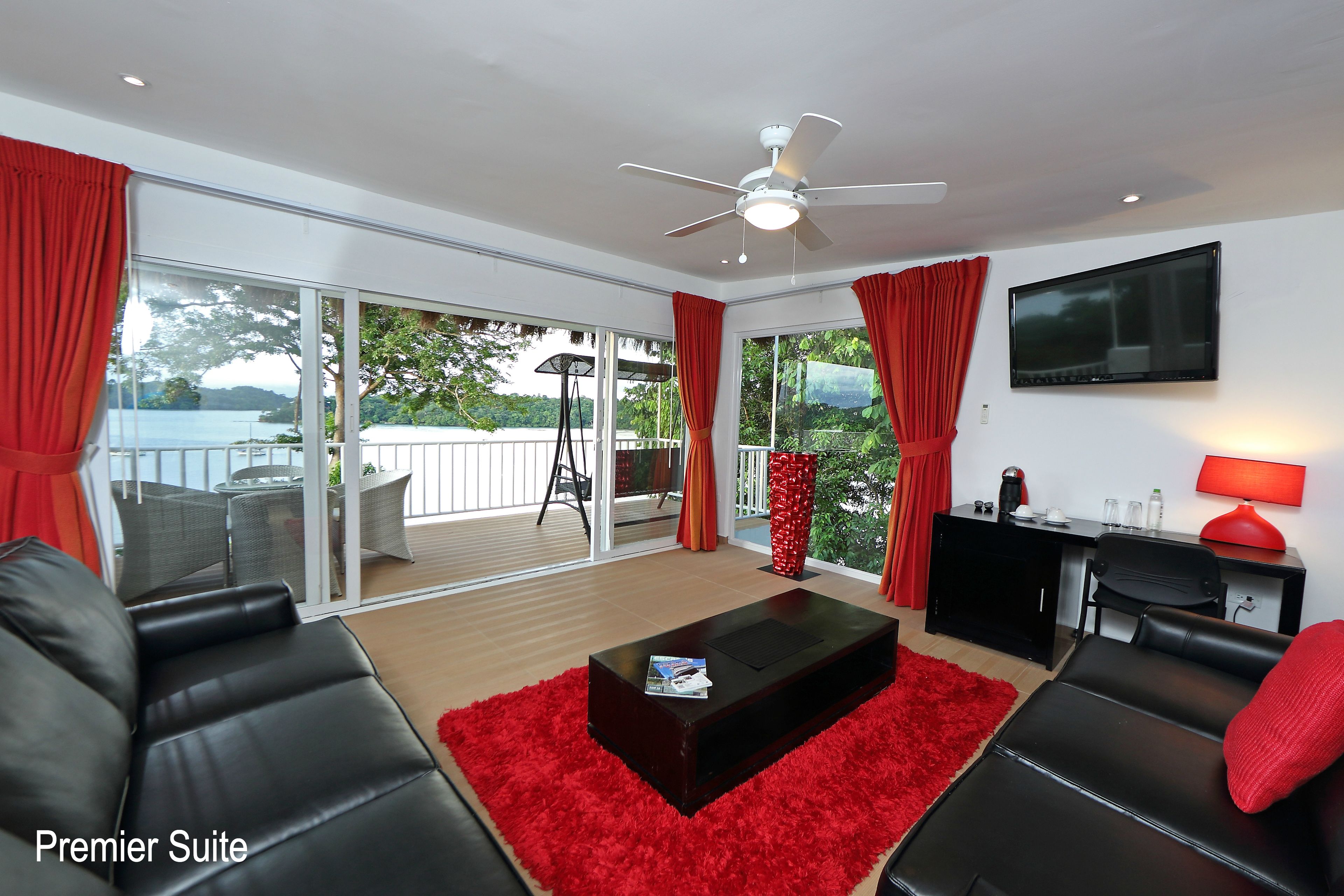 premier suite, 2 bedrooms, hot tub, sea facing | living room | flat-screen tv