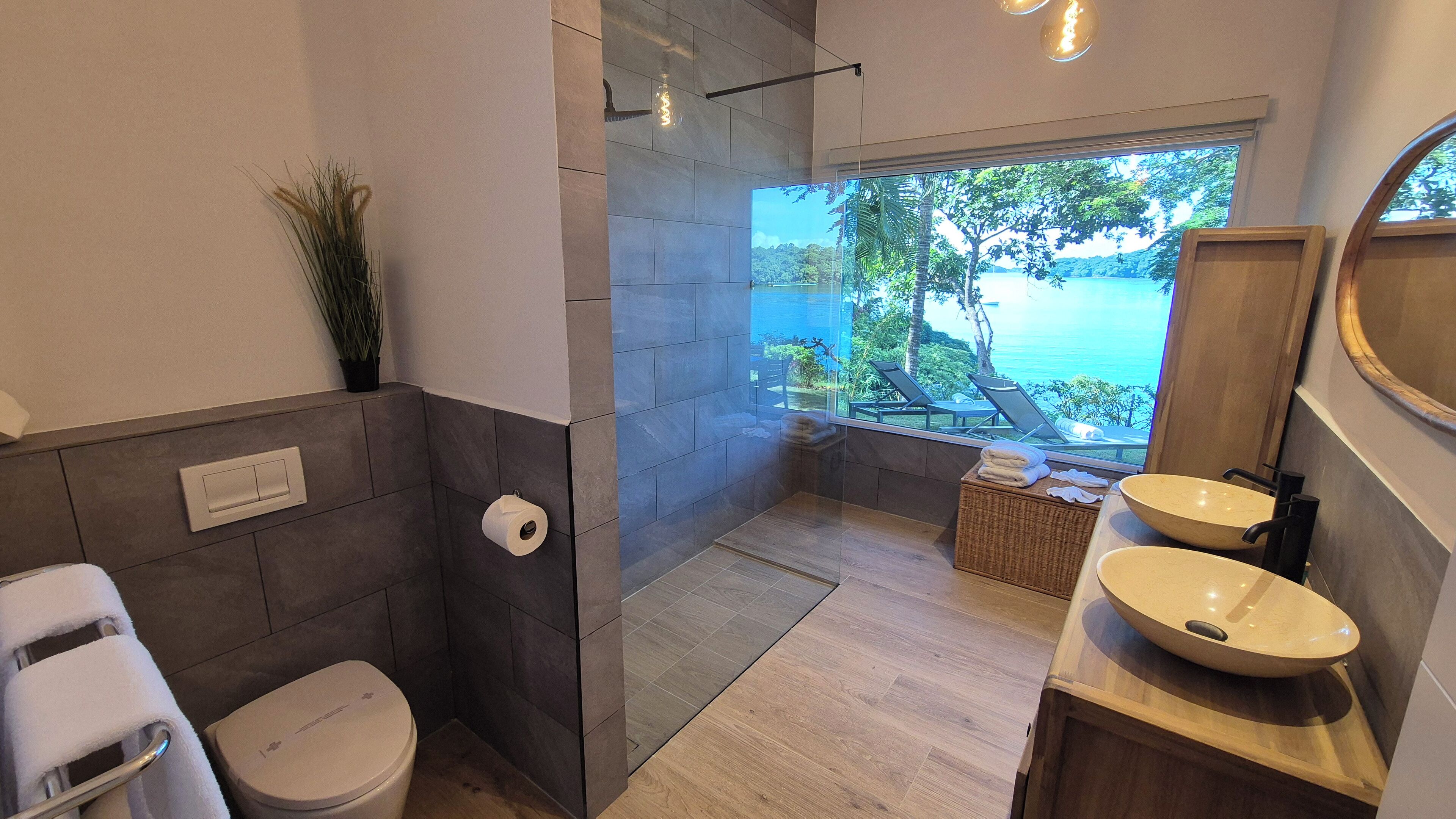 deluxe bungalow, sea facing | bathroom | free toiletries, hair dryer, towels, soap