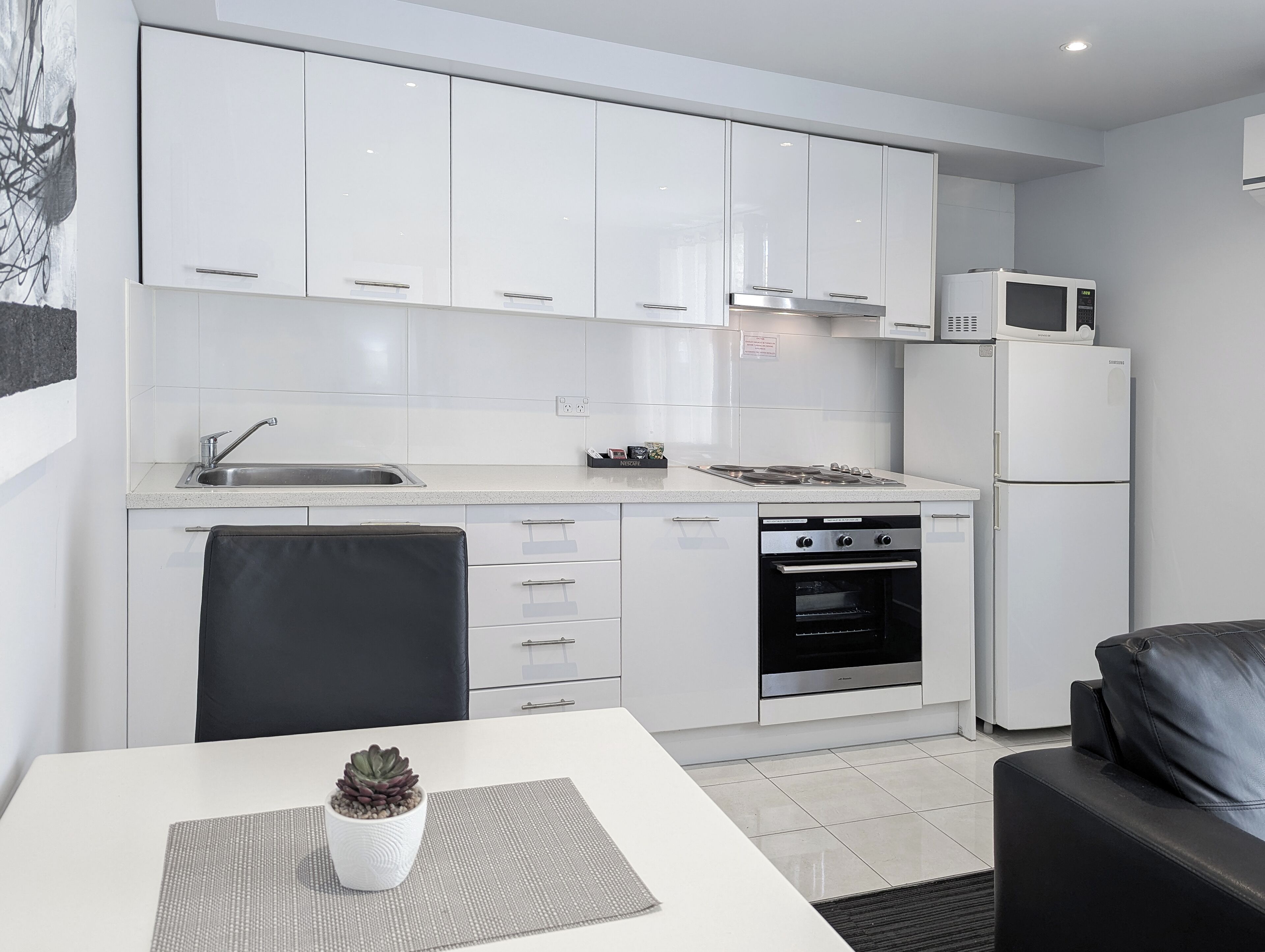 One-Bedroom Apartment | Private kitchen | Full-sized fridge, microwave, oven, stovetop