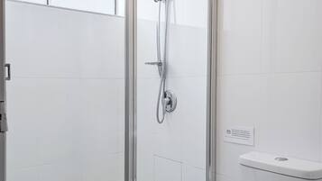 Studio Apartment | Bathroom | Shower, hair dryer, towels, soap