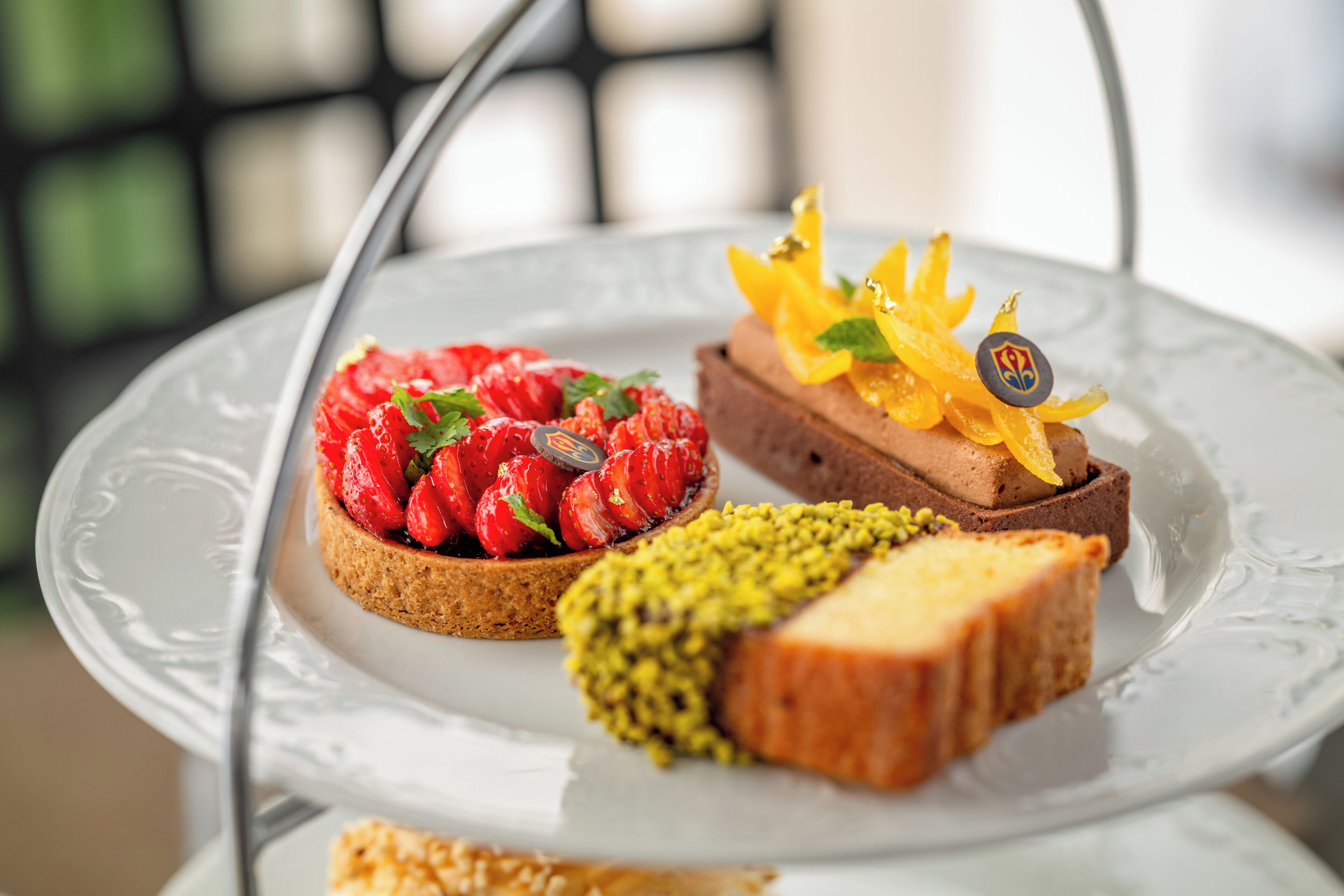 A dessert plate with three different types of pastries.