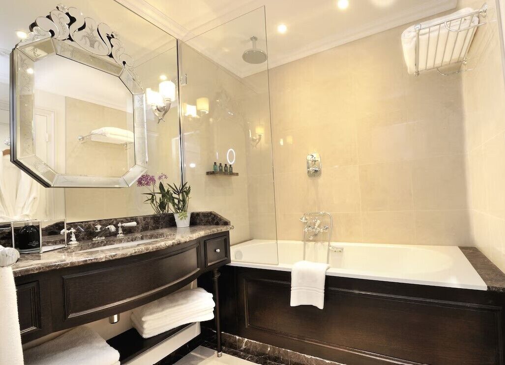 combined shower/bathtub, rainfall showerhead, designer toiletries