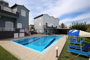 Seasonal outdoor pool, open 9:00 AM to 7:00 PM, pool umbrellas