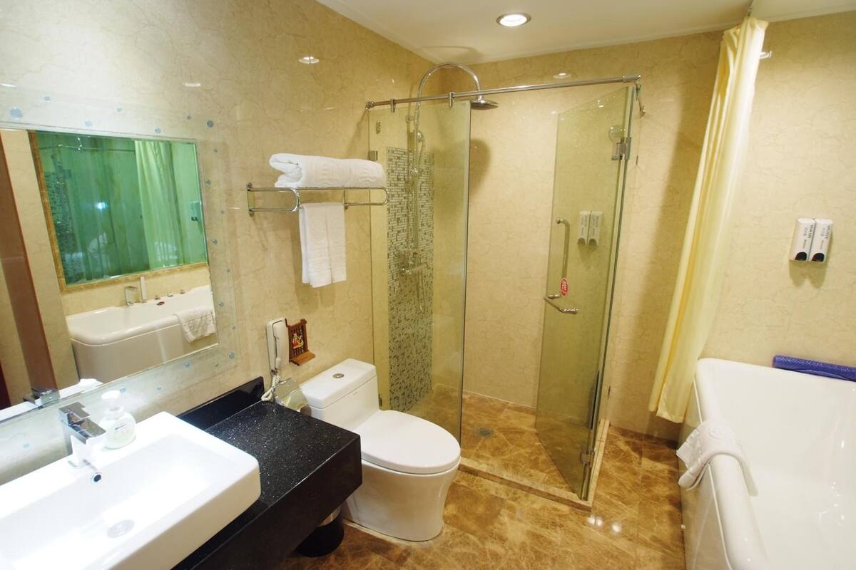 separate bathtub and shower, free toiletries, hair dryer, slippers