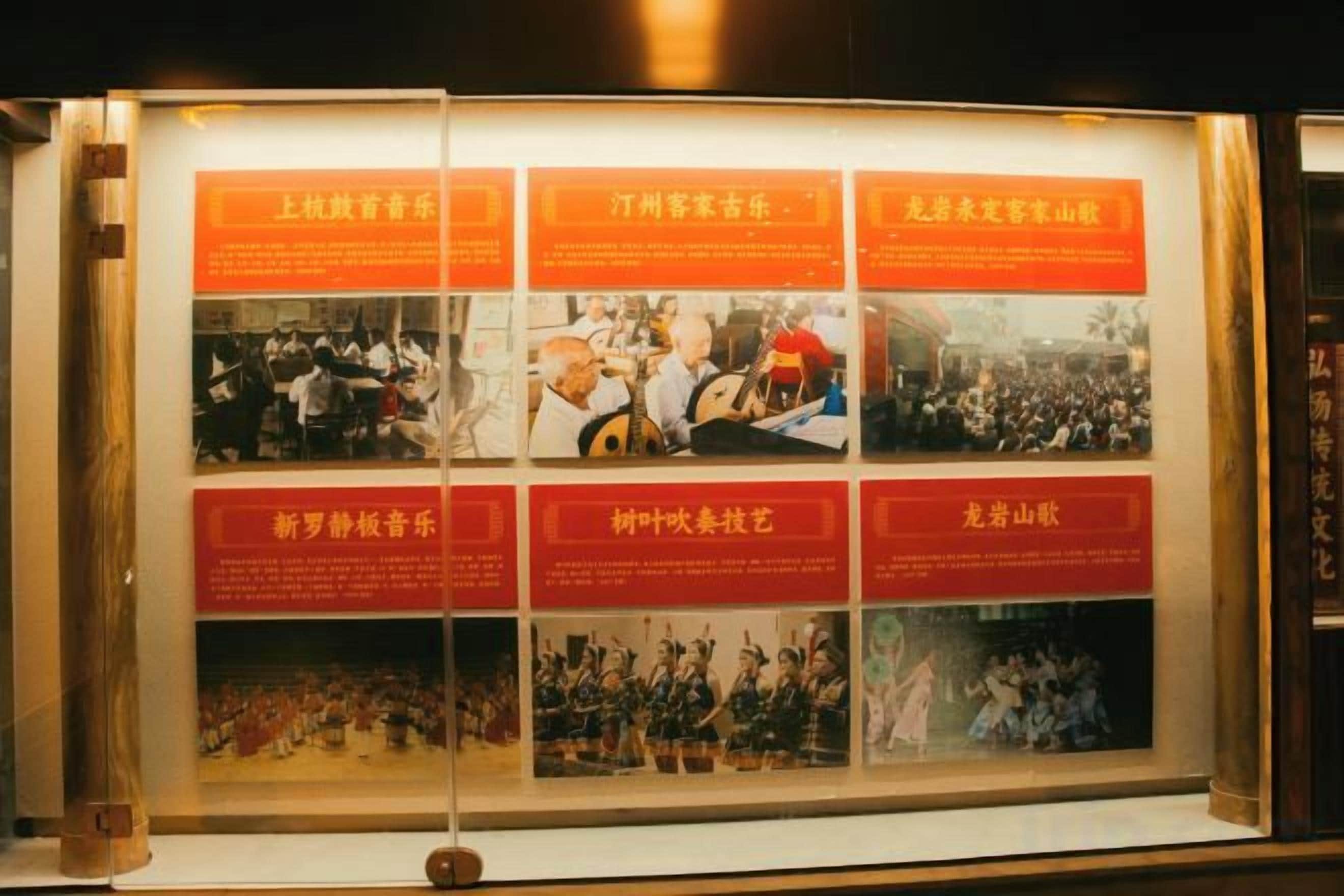 A display case with multiple panels, each containing text and photographs.