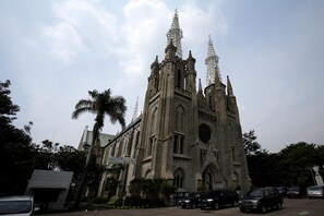 A large cathedral with a tall spire and multiple towers.