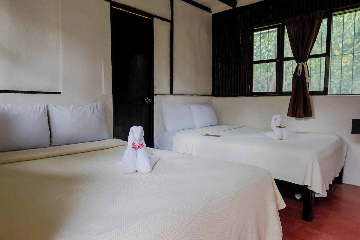 economy quadruple room, multiple beds, private bathroom | 1 bedroom, iron/ironing board, free wifi, bed sheets