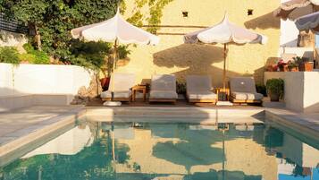 Outdoor pool, open 8:30 AM to 6:30 PM, pool umbrellas, pool loungers