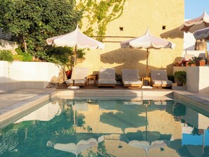 Outdoor pool, open 8:30 AM to 6:30 PM, pool umbrellas, pool loungers