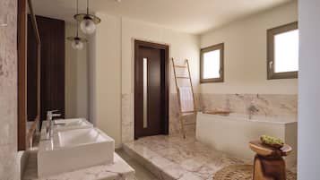 A modern bathroom with a large sink, a bathtub, and a wooden ladder.