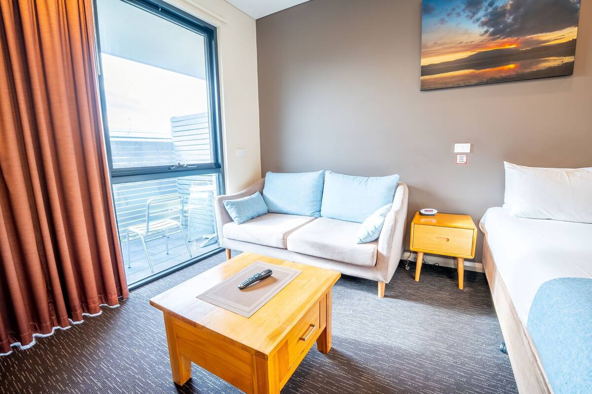Superior Queen Suite | Desk, laptop workspace, blackout drapes, iron/ironing board