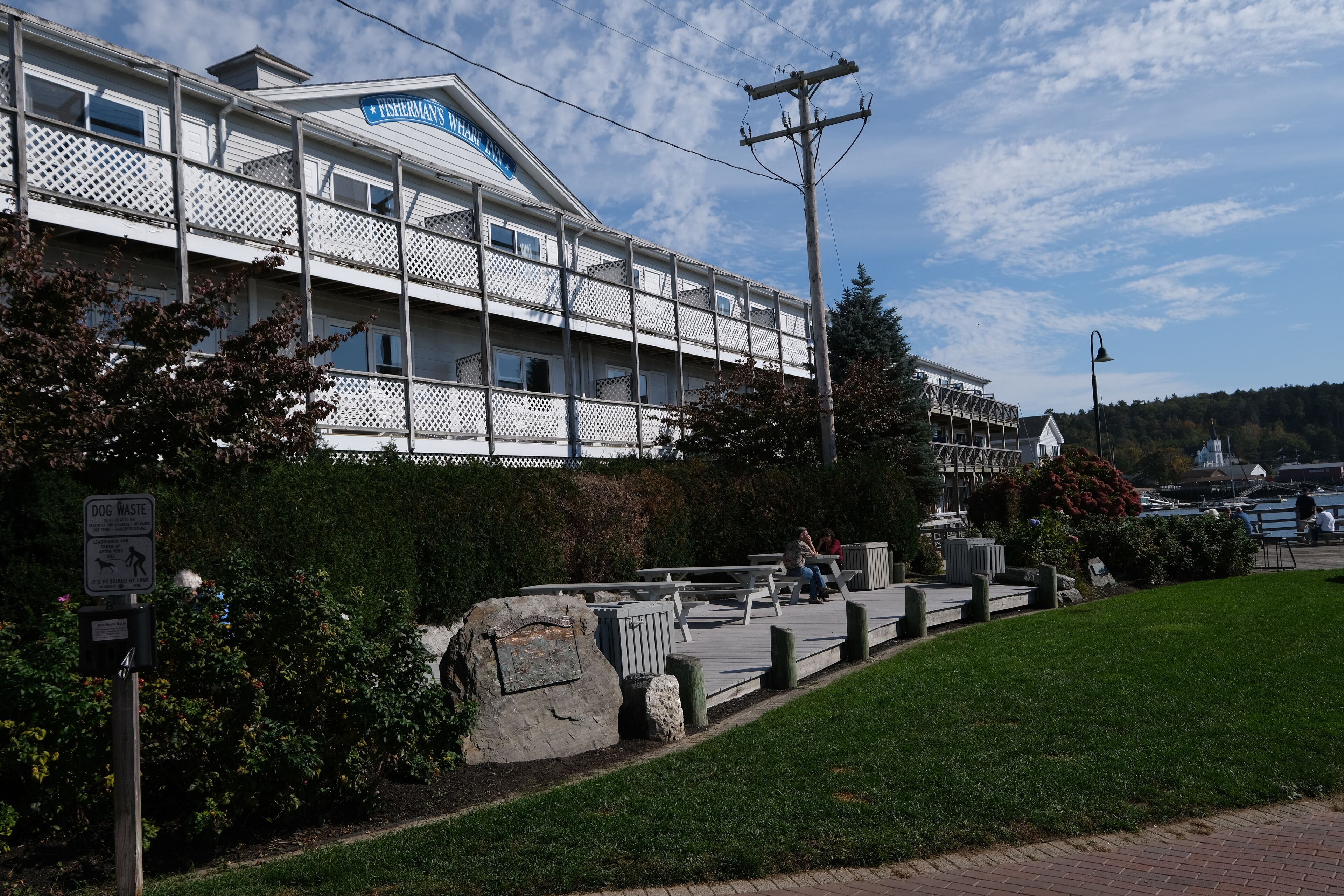 A white building with a sign reading "Fisherman's Wharf."