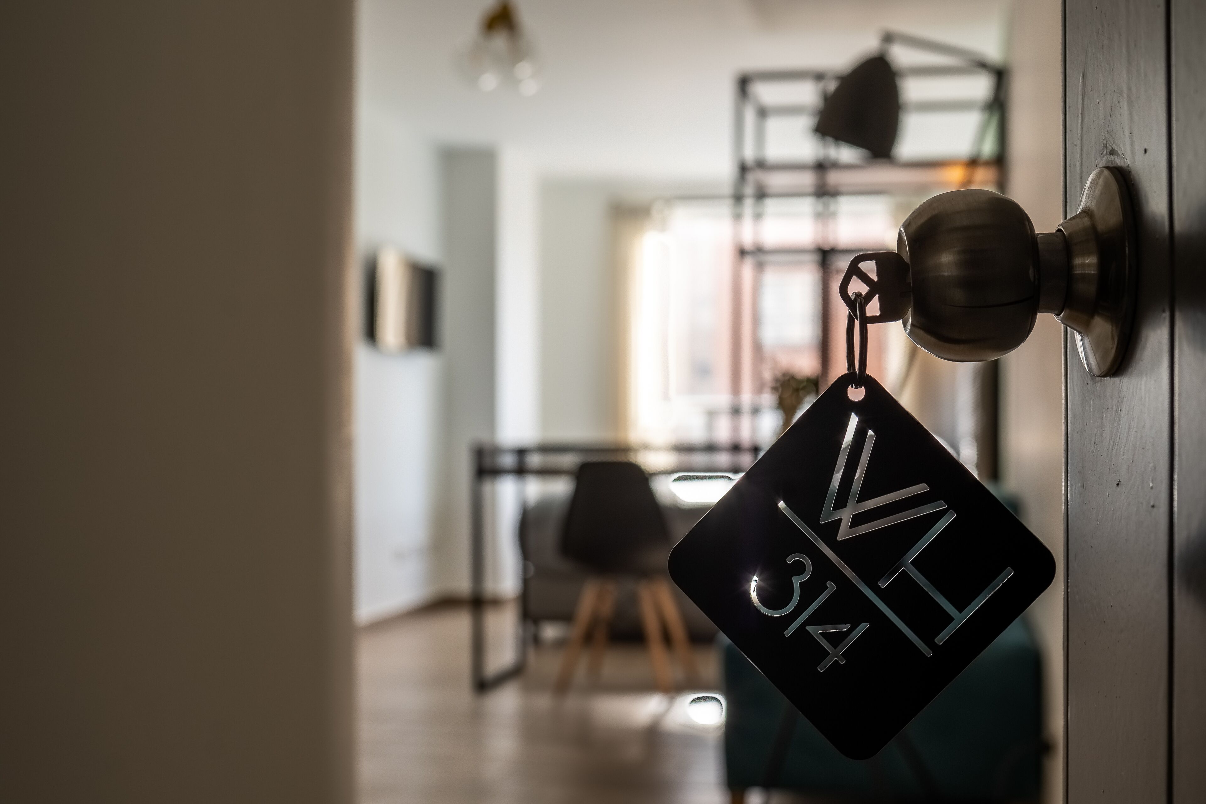 A door with a keycard reader and a sign with "V 34" visible.