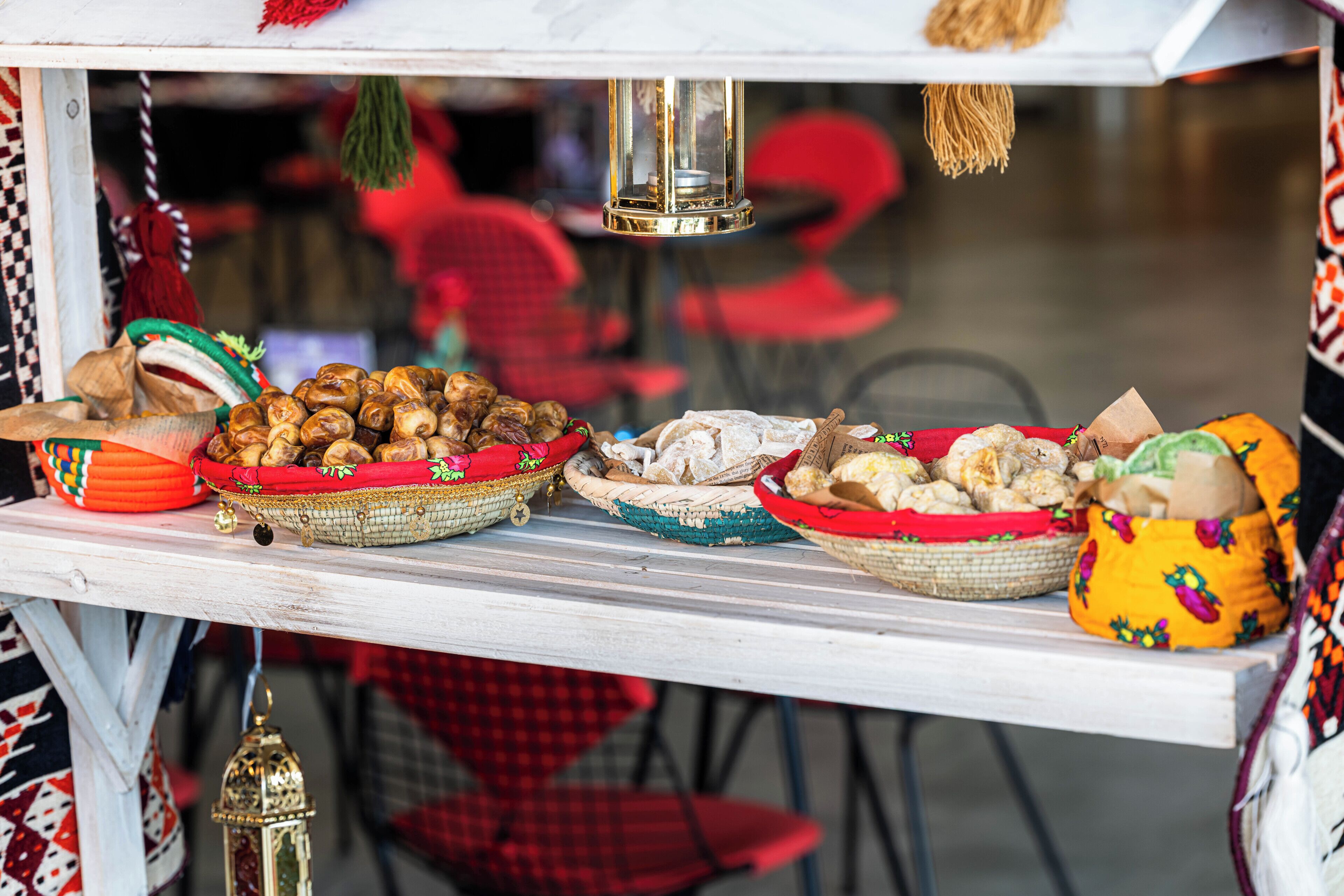 A table with various food items displayed in baskets.