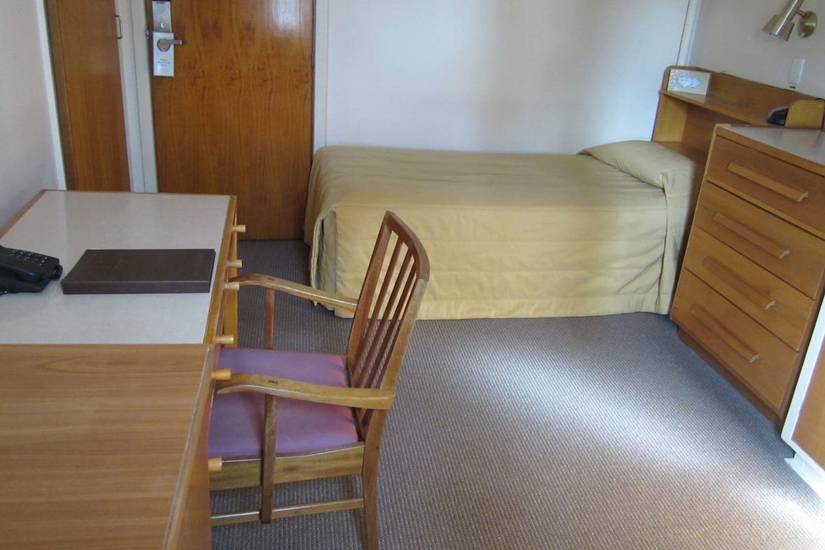 Basic Single Room, 1 Twin Bed | Desk, iron/ironing board, cribs/infant beds, rollaway beds
