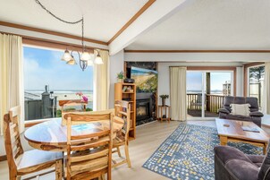 Condo, 1 Bedroom, Non Smoking (Upstairs, Pet Friendly) | Living area | 65-inch LED TV with cable channels, TV, fireplace