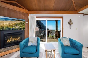 Condo, 1 Bedroom, Non Smoking (Upstairs, Pet Friendly) | Living area | 65-inch LED TV with cable channels, TV, fireplace