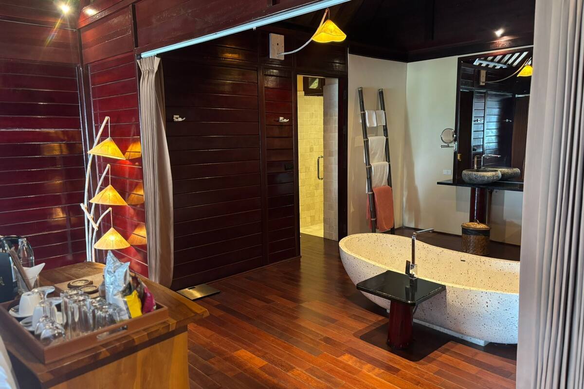 designer toiletries, hair dryer, bathrobes, slippers