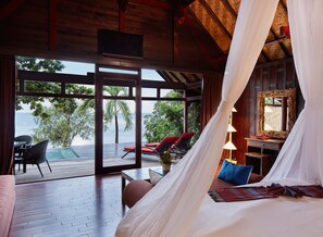 Deluxe Beachfront Pool Villa | Minibar, in-room safe, individually decorated, individually furnished