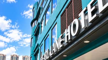 A modern building with the sign 'Pearl Line Hotel' indicating a hotel establishment.
