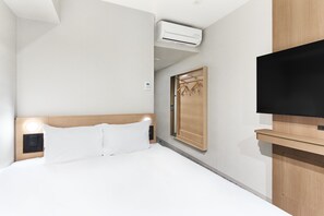 Edredones de plumas, escritorio, cortinas opacas y wifi gratis