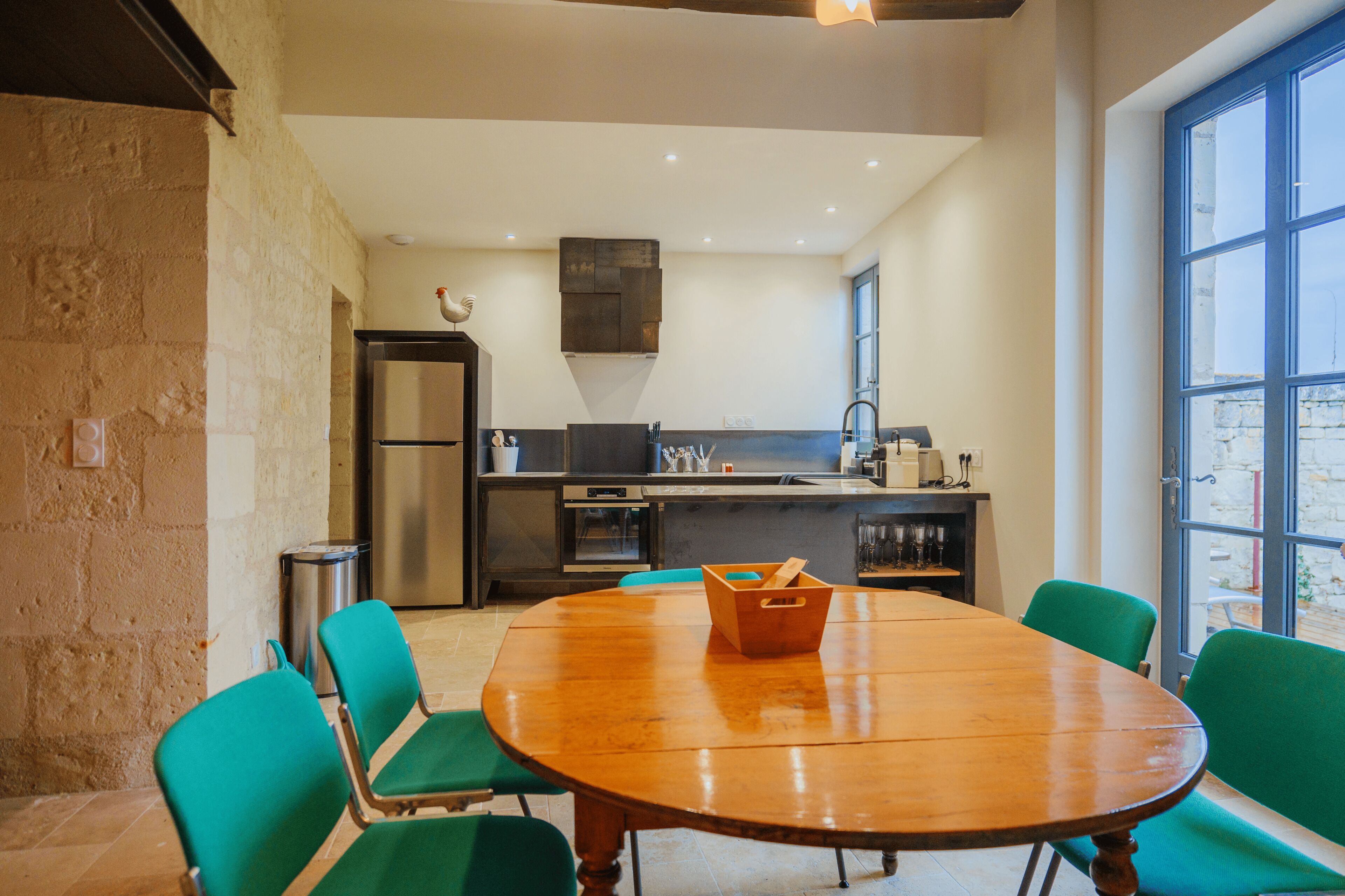 A modern kitchen with a dining area.