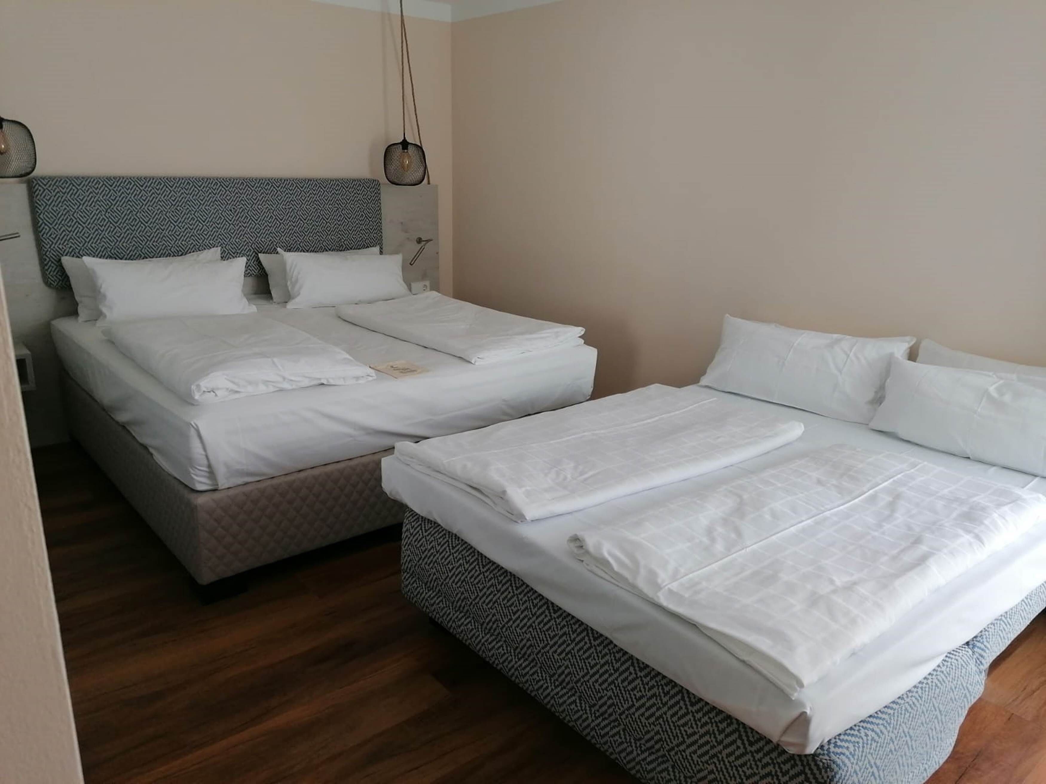 quadruple room | hypo-allergenic bedding, down duvets, minibar, desk