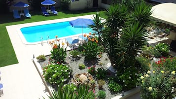 Seasonal outdoor pool, pool umbrellas, pool loungers