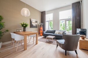 Apartment, 1 Bedroom | Living area | 55-cm flat-screen TV with cable channels, TV, DVD player