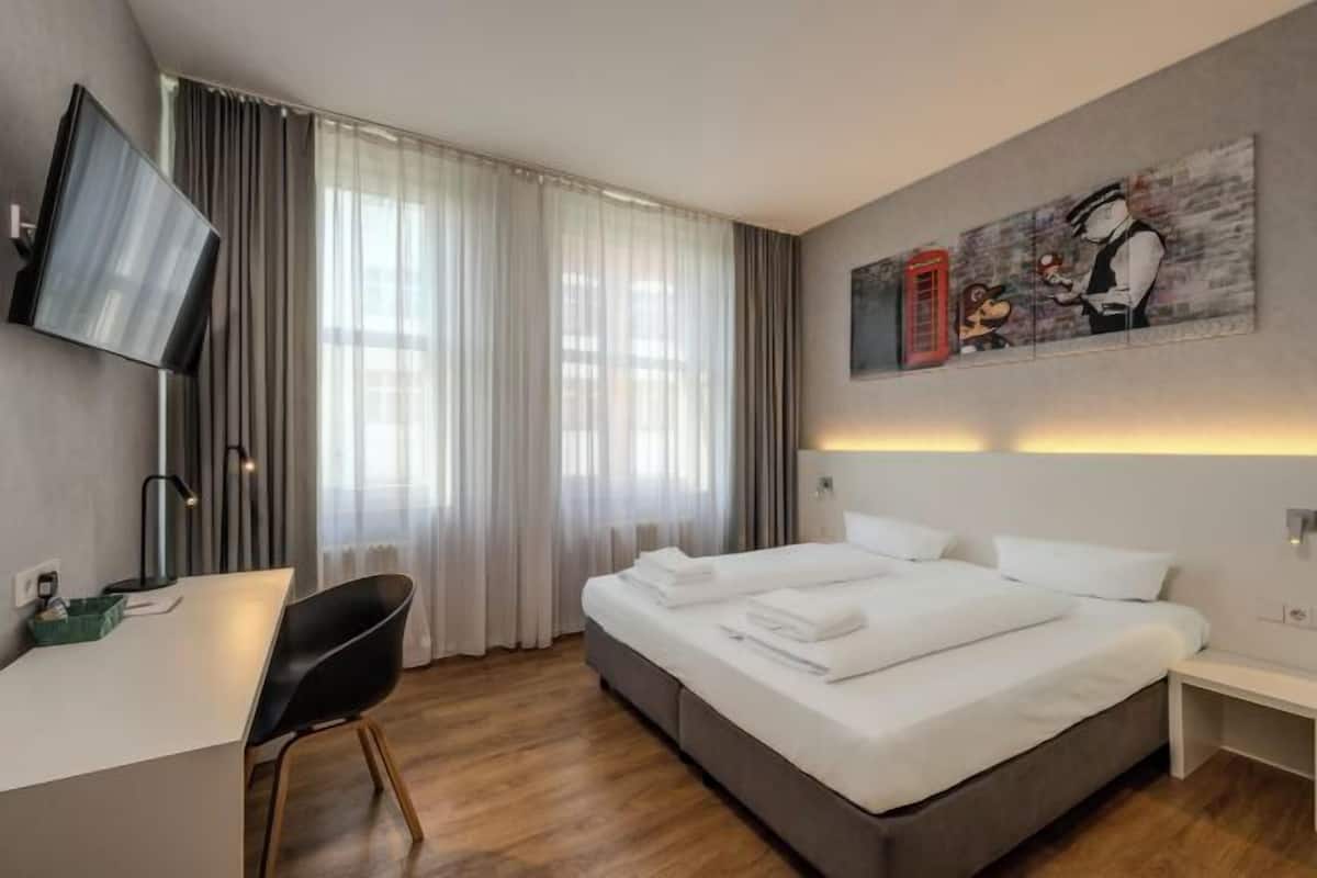 Premium bedding, pillowtop beds, desk, blackout drapes