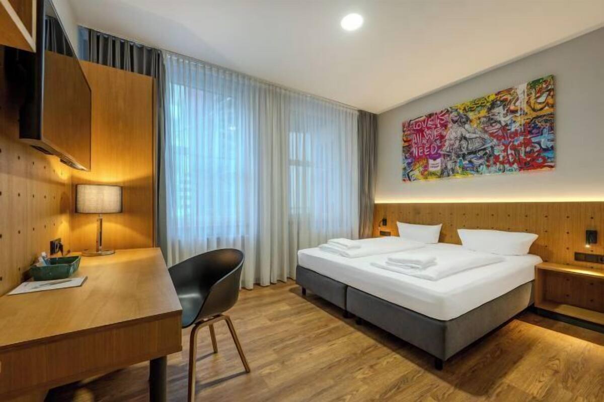 Premium bedding, pillowtop beds, desk, blackout drapes