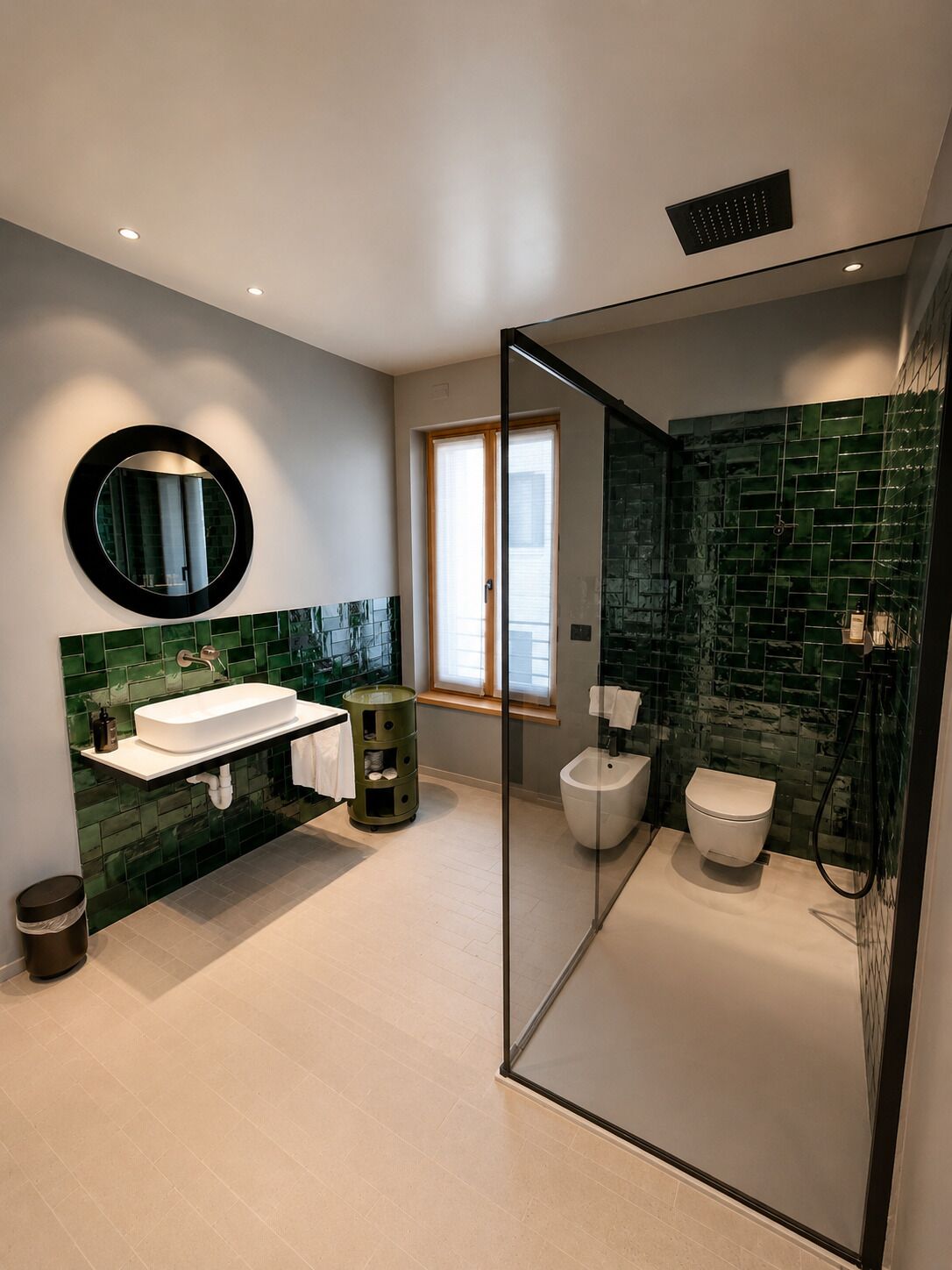 A modern bathroom with a glass-enclosed shower, a white sink, and a bidet.