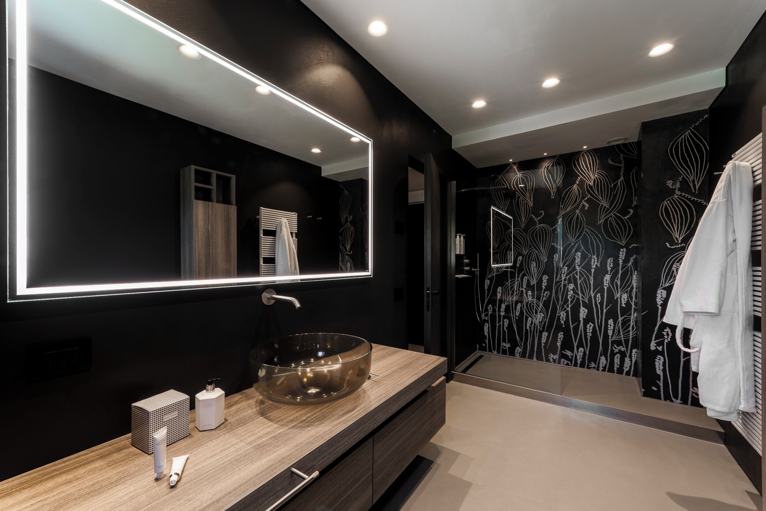 deluxe suite | bathroom | rainfall showerhead, designer toiletries, hair dryer, bidet