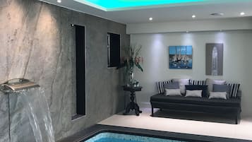 Indoor pool, open 8 AM to 7:00 PM, pool umbrellas, pool loungers