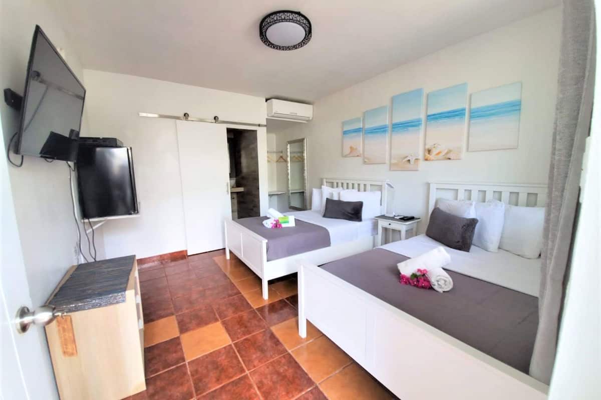 standard double room, 2 double beds | individually decorated, individually furnished, iron/ironing board