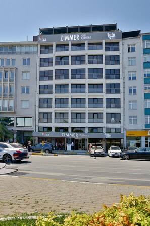 A multi-story hotel with 'PITZA', 'ZIMMER', and 'Lulu' signage. - Zimmer Bosphorus Hotel - Special Class (Istanbul)