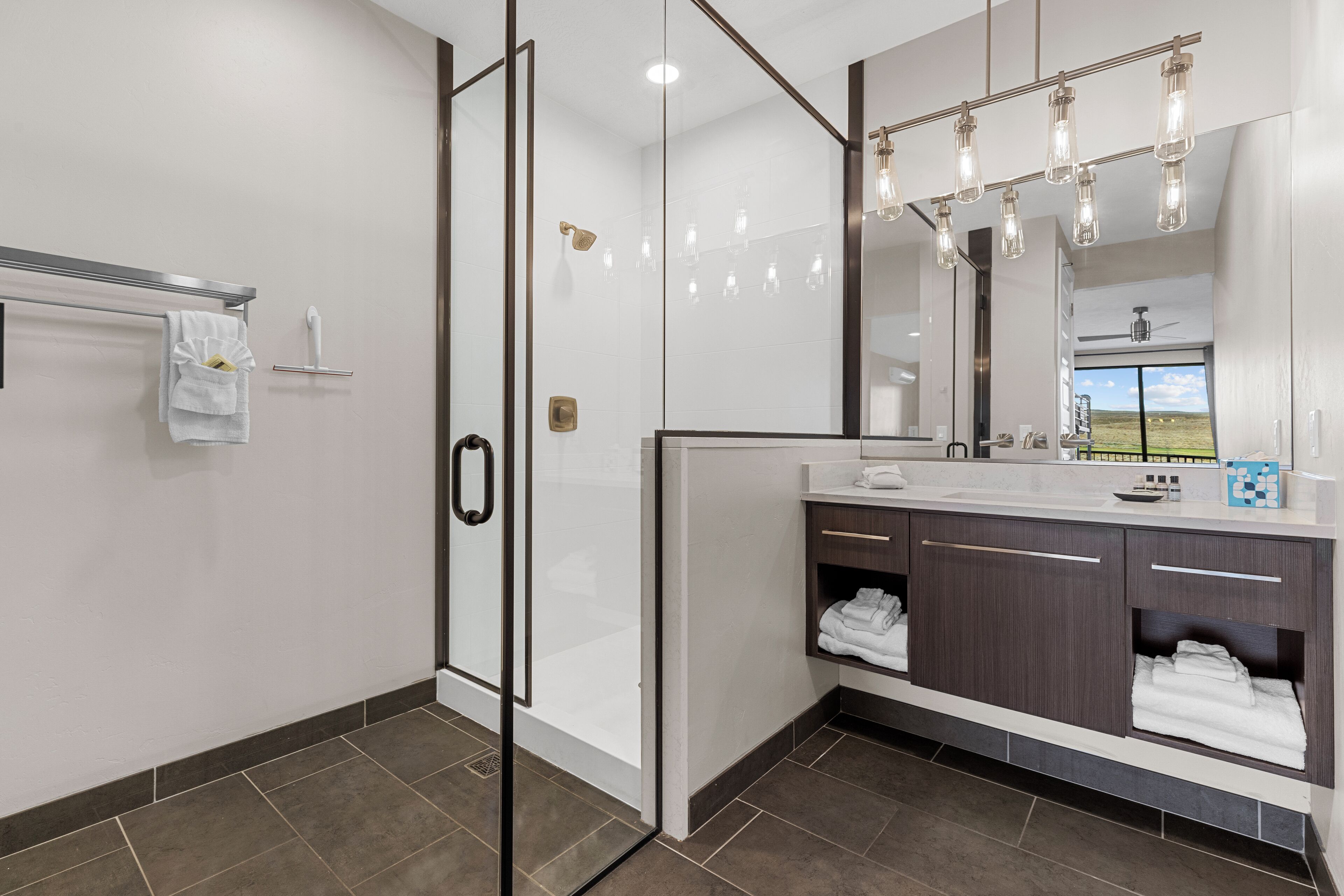 two bedroom deluxe condo | bathroom | free toiletries, hair dryer, towels, soap