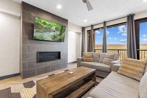 Two Bedroom Deluxe Condo | Living room | 32-inch Smart TV with digital channels, streaming services
