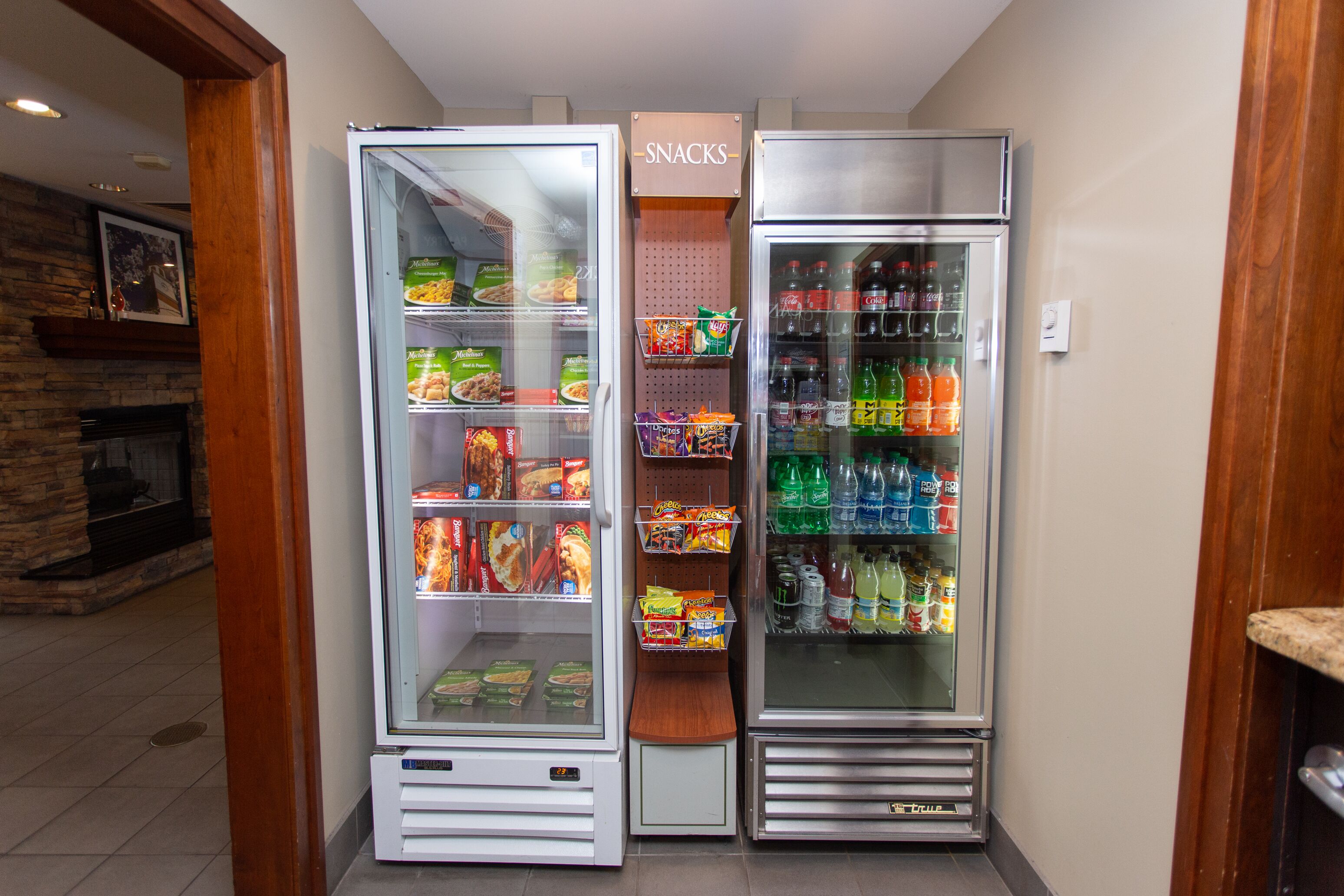 A snack and beverage vending machine area with various snacks and drinks.