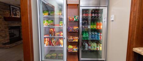 A snack and beverage vending machine area with various snacks and drinks.