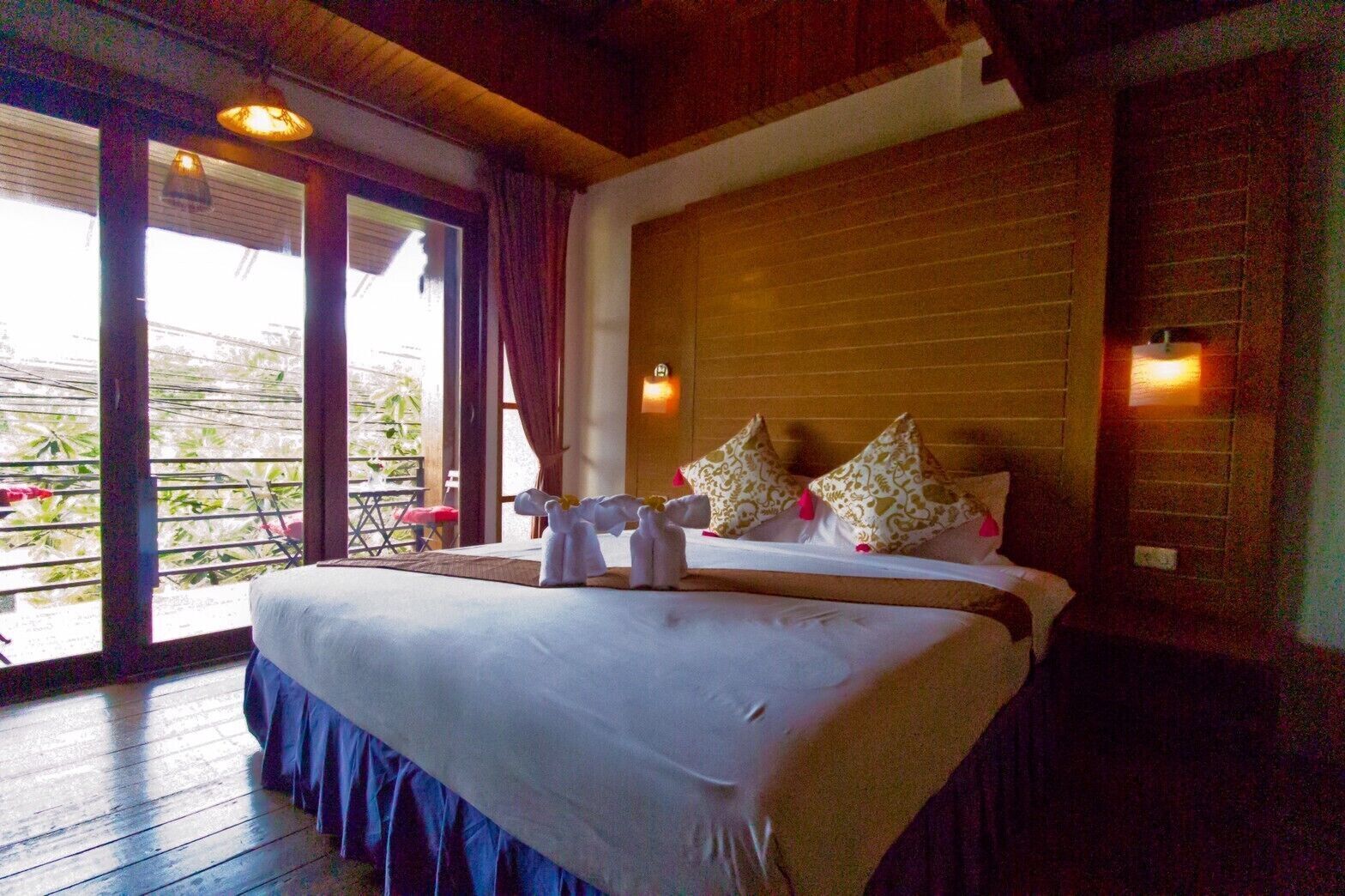 Premium bedding, desk, laptop workspace, blackout drapes