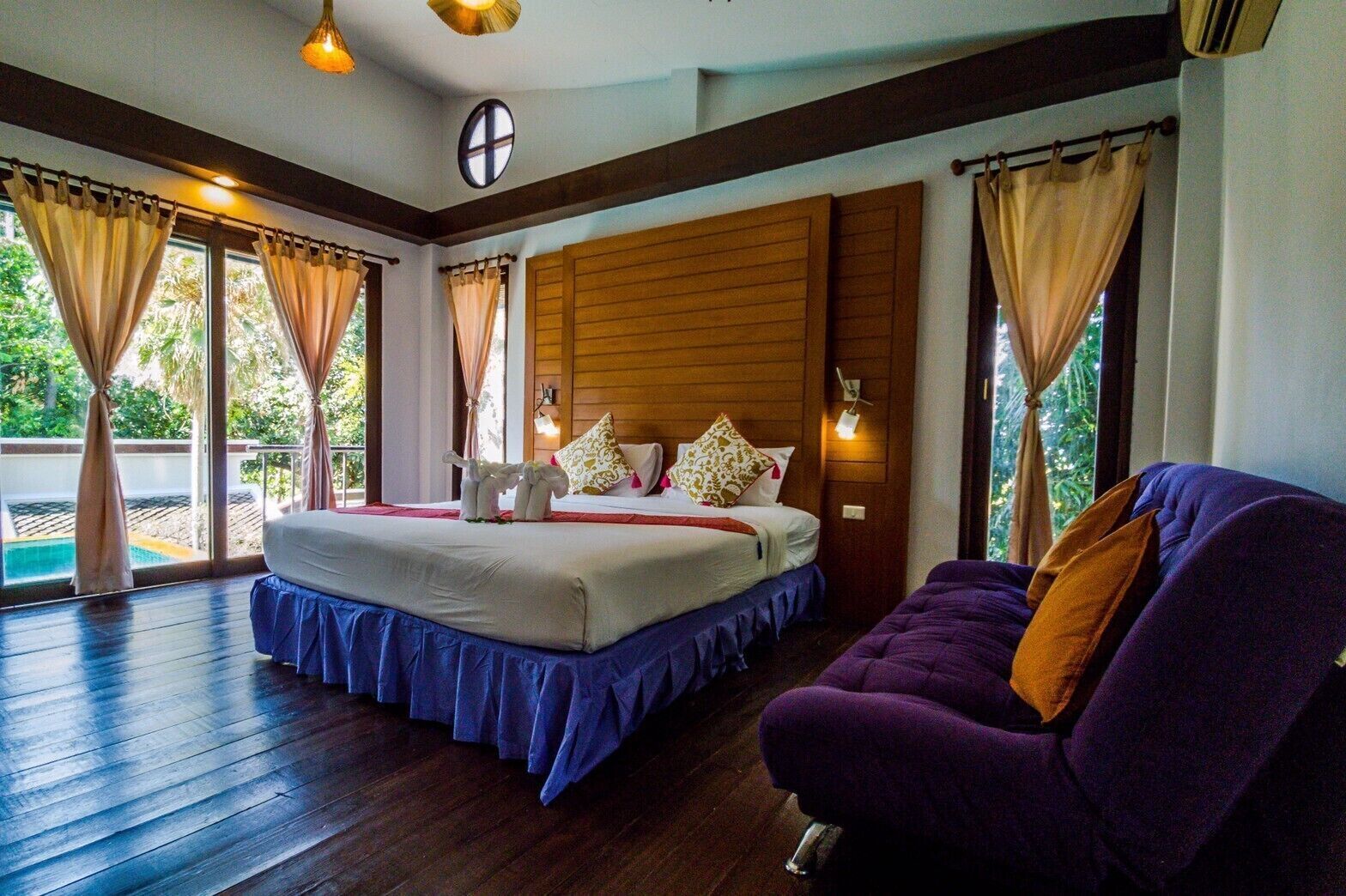 Premium bedding, desk, laptop workspace, blackout drapes