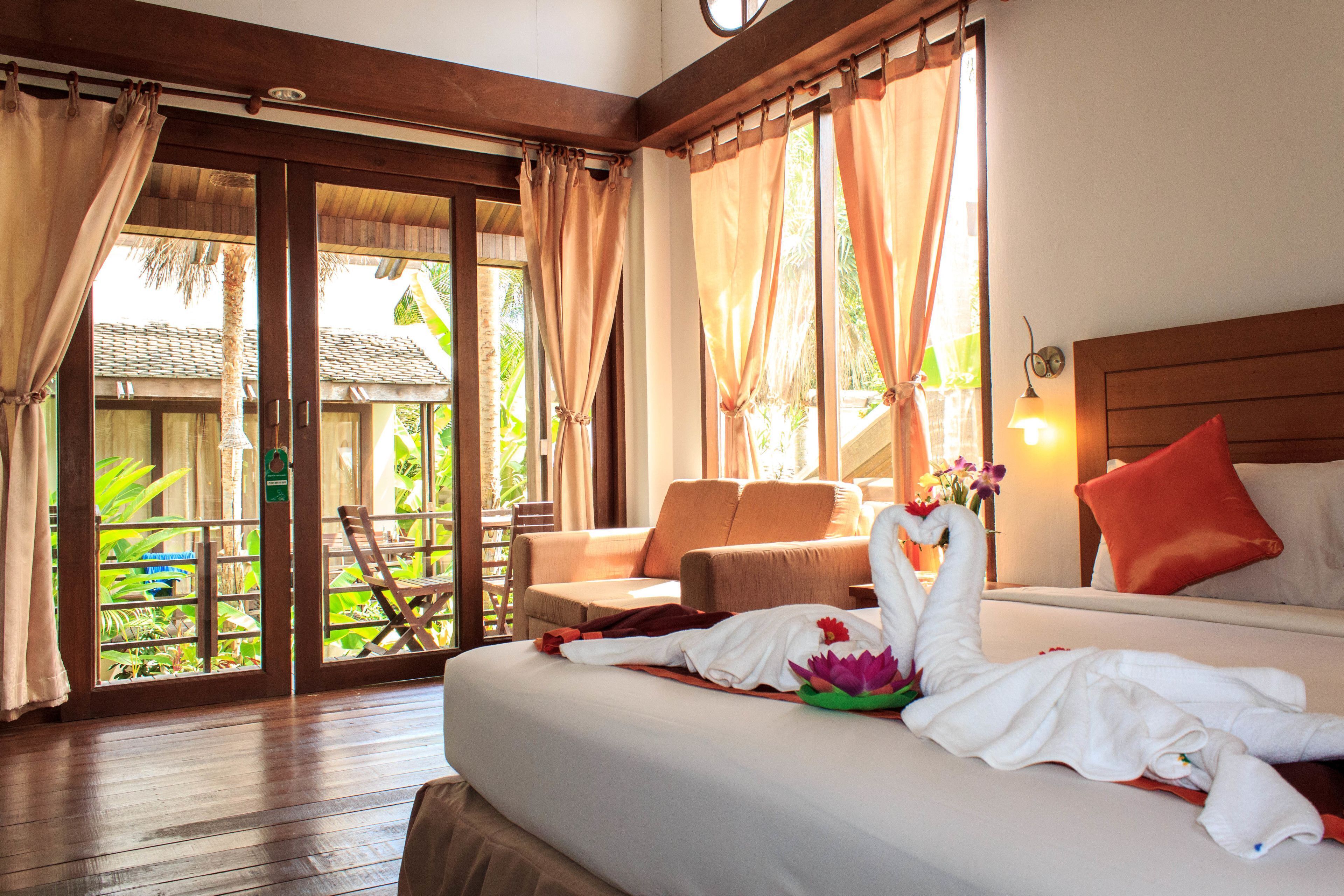 Premium bedding, desk, laptop workspace, blackout drapes