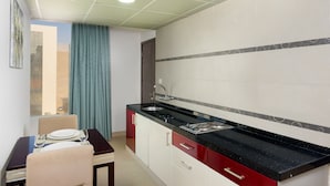 Deluxe Suite, 1 King Bed | Minibar, in-room safe, desk, iron/ironing board (on request)