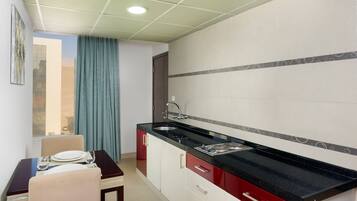 Deluxe Suite, 1 King Bed | Minibar, in-room safe, desk, iron/ironing board