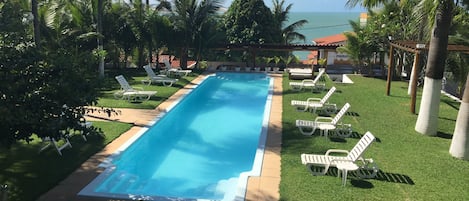 Outdoor pool, pool umbrellas, sun loungers