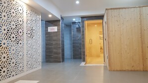A modern hotel lobby with a decorative white lattice wall, a wooden partition, and a tiled floor. - Palace Appart Hôtel (Algiers)