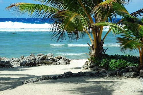 On the beach, sun-loungers