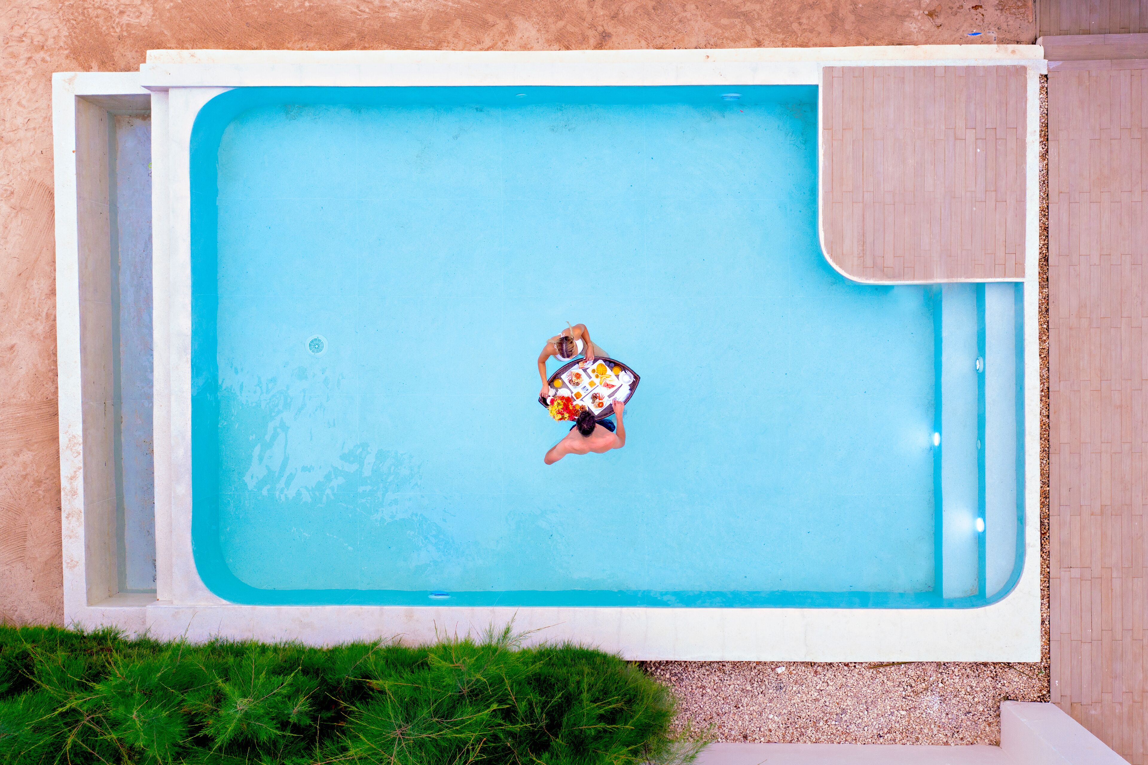 A rectangular swimming pool with a person in the center.